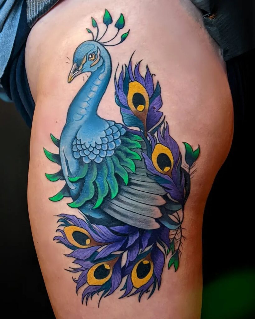 Tattoo of a peacock on your thigh