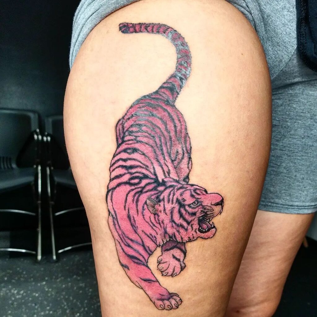 Tattoo of a pink tiger on the hip