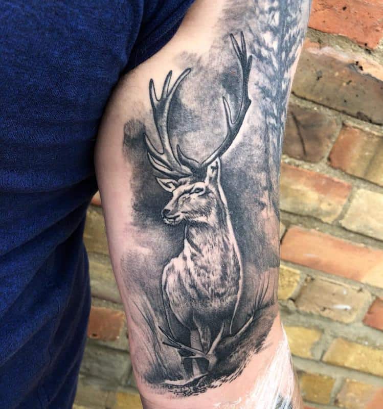 Tattoo of a deer on the bicep