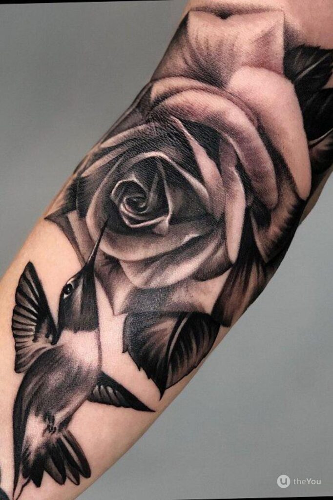 Rose tattoo on bicep