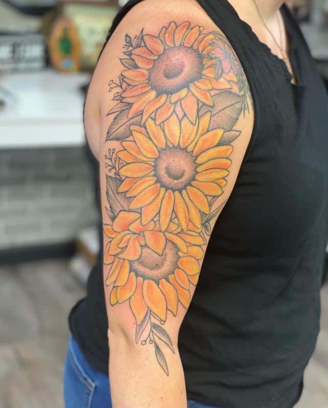 Sunflower tattoo on the biceps