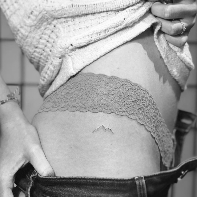 Tattoo of a Mountain on the Thigh