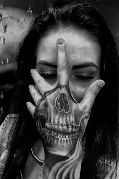 Tattoo with a skull on the wrist