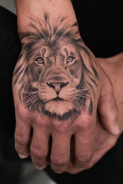 Tattoo of a lion on the hand