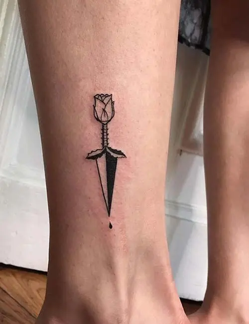 Tattoo of a rose on the ankle