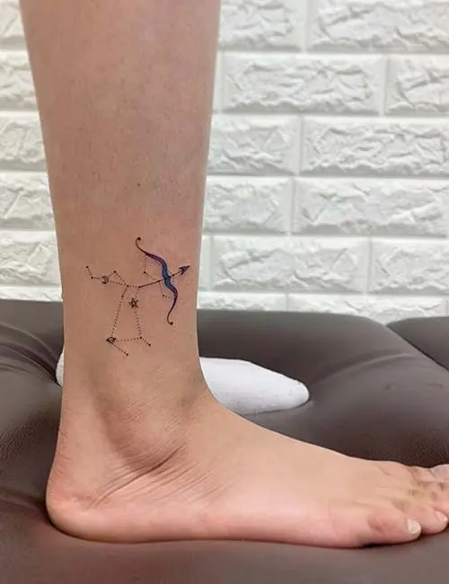 Tattoo with arrow and constellation