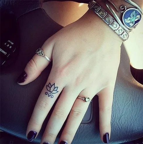 Female finger tattoos