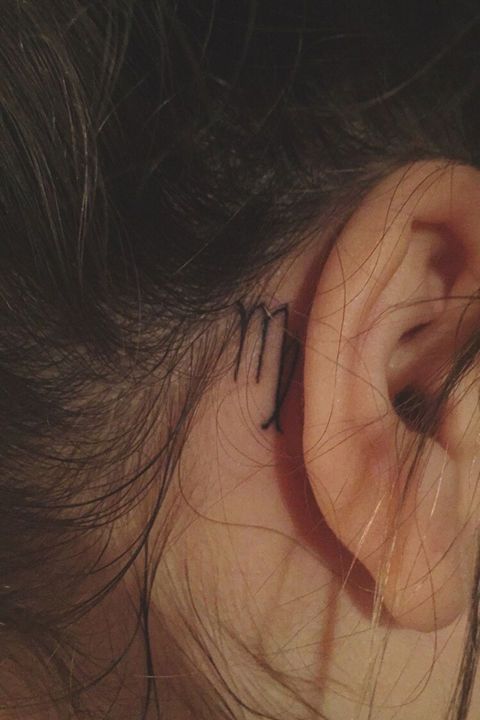 Virgo zodiac sign tattoo behind the ear