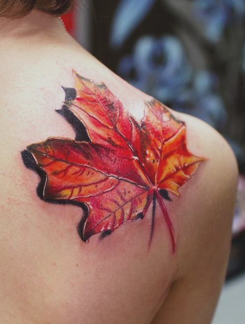 3D tattoo of a single maple leaf on the scapula