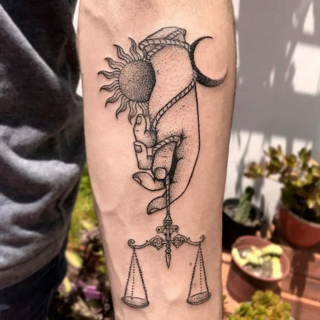 Libra zodiac sign tattoo on the arm