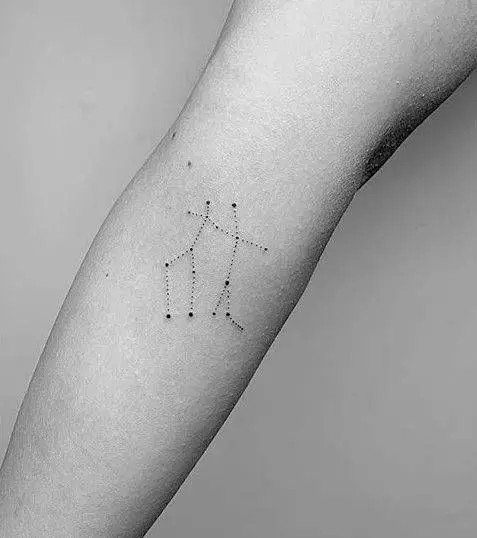 Tattoo of the zodiac sign Gemini on the arm