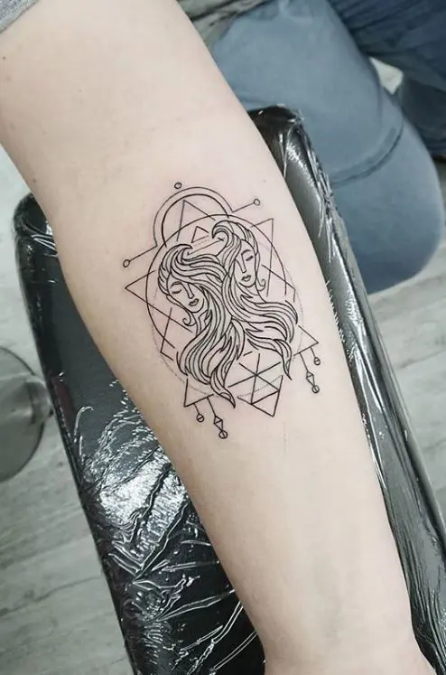 Tattoo of the zodiac sign Gemini on the arm