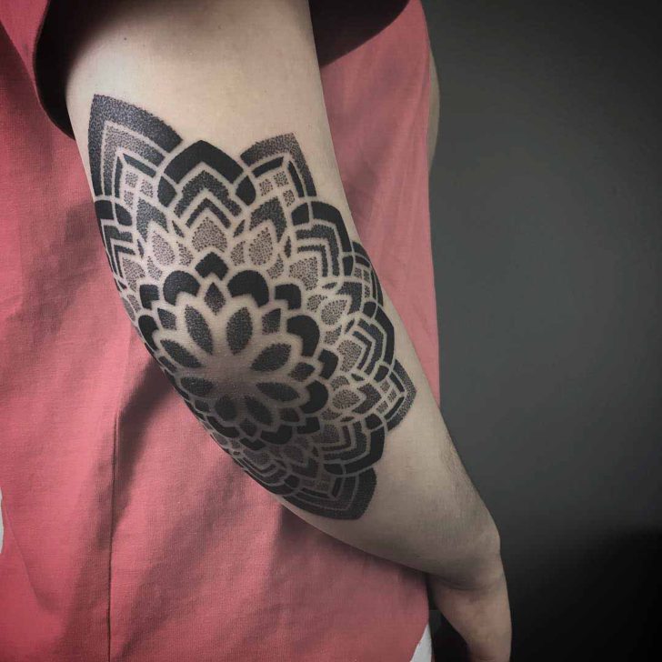 Mandala tattoo on the elbow