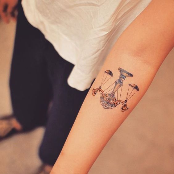 Libra zodiac sign tattoo on forearm