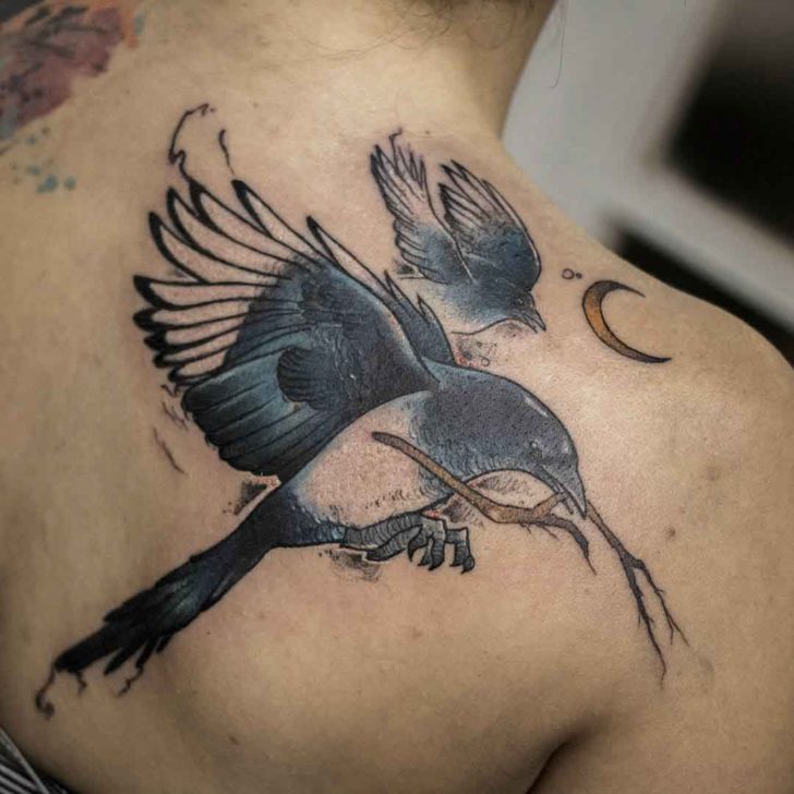 Magpies tattoos on the shoulder blade