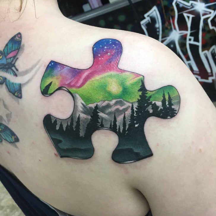 Tattoo Landscape Piece of Puzzle on the shoulder blade