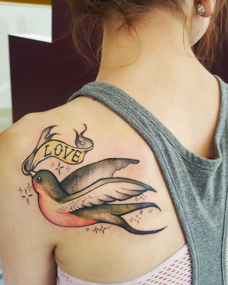 Bird tattoo on the shoulder blade