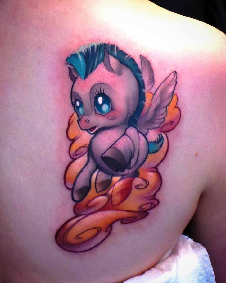 Small tattoo of a cartoon pegasus on the scapula