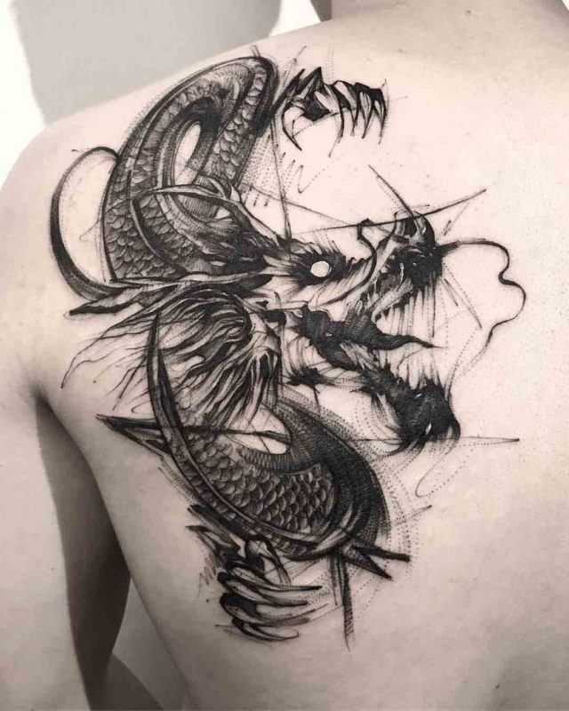 Grey Dragon tattoo on the scapula