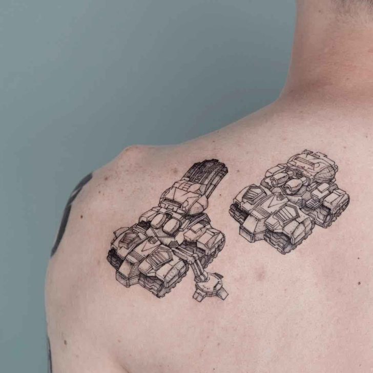 Tank tattoo on the shoulder blade