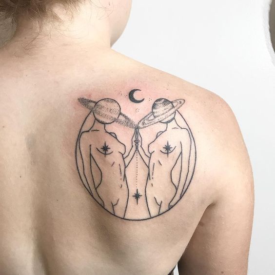 Cool tattoo of the zodiac sign Gemini on the back