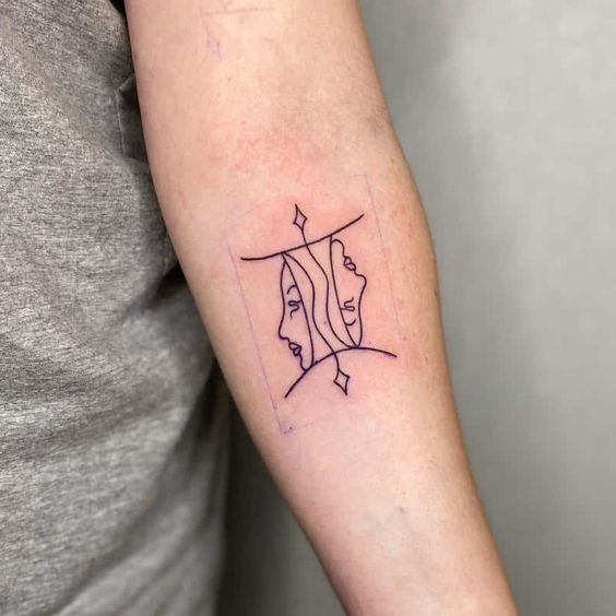 Tattoo sign of the zodiac Gemini in the style of minimalism on the forearm