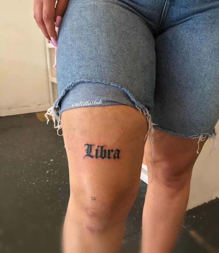 Libra tattoo on the leg