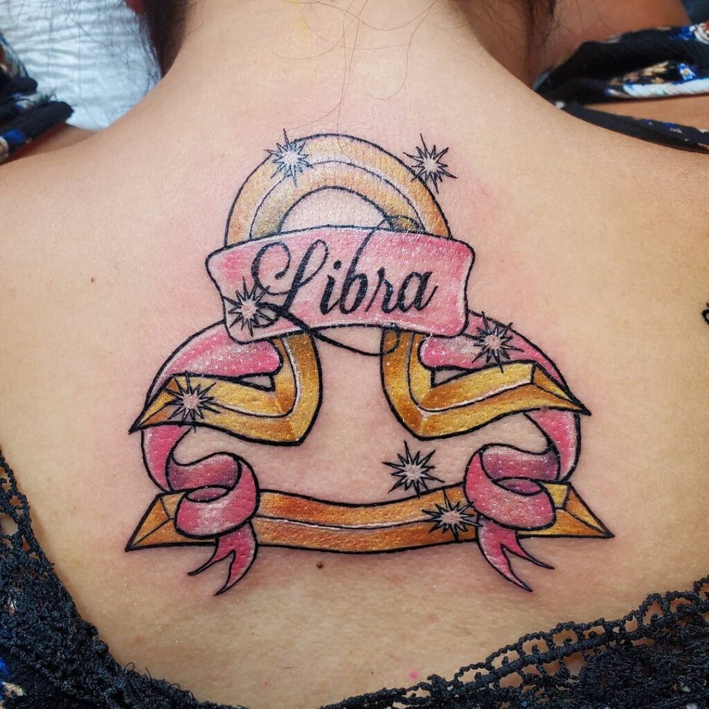 Bright color tattoo of the zodiac sign Libra on the back