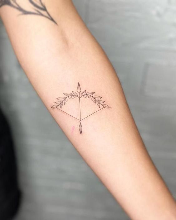 Tattoo of the zodiac sign Sagittarius on the arm