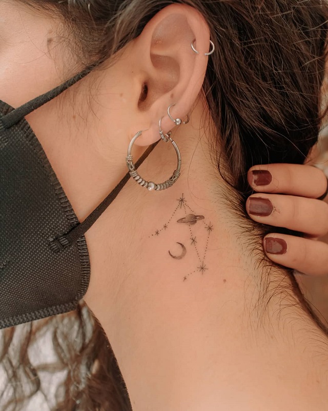 Libra constellation tattooed on the neck