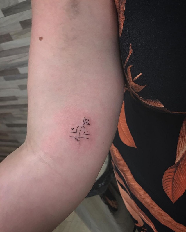 Small tattoo symbol of Libra