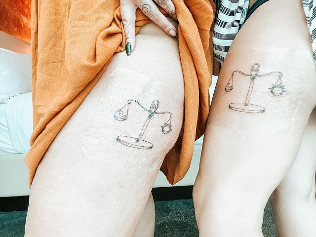 Paired tattoo of the sign of Libra