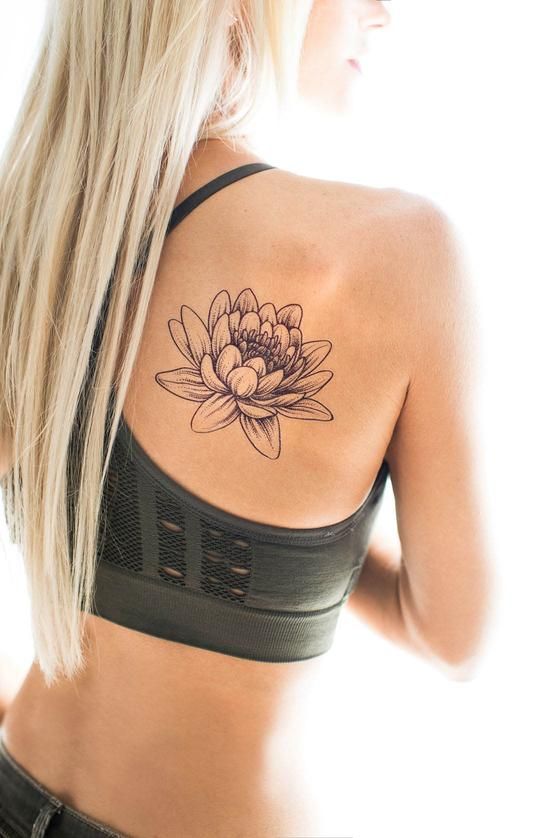 Lotus tattoo on the shoulder blade