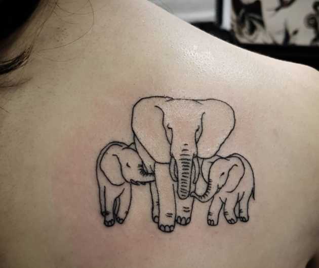 Elephant tattoo on the scapula