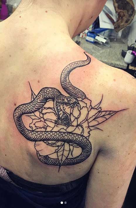 Snake tattoo on the scapula