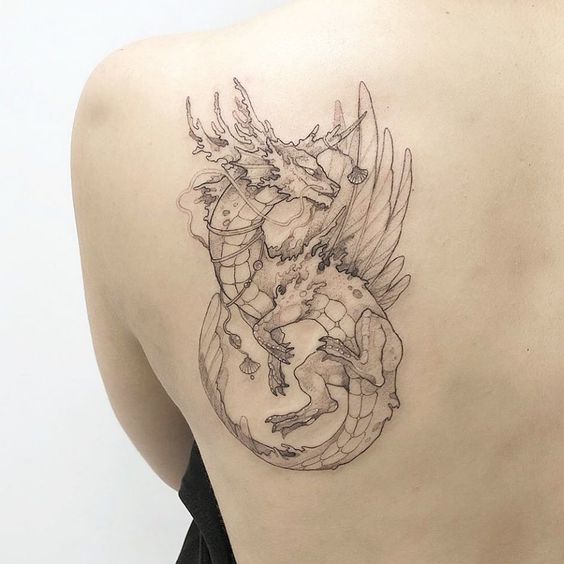 Dragon tattoo on the shoulder blade