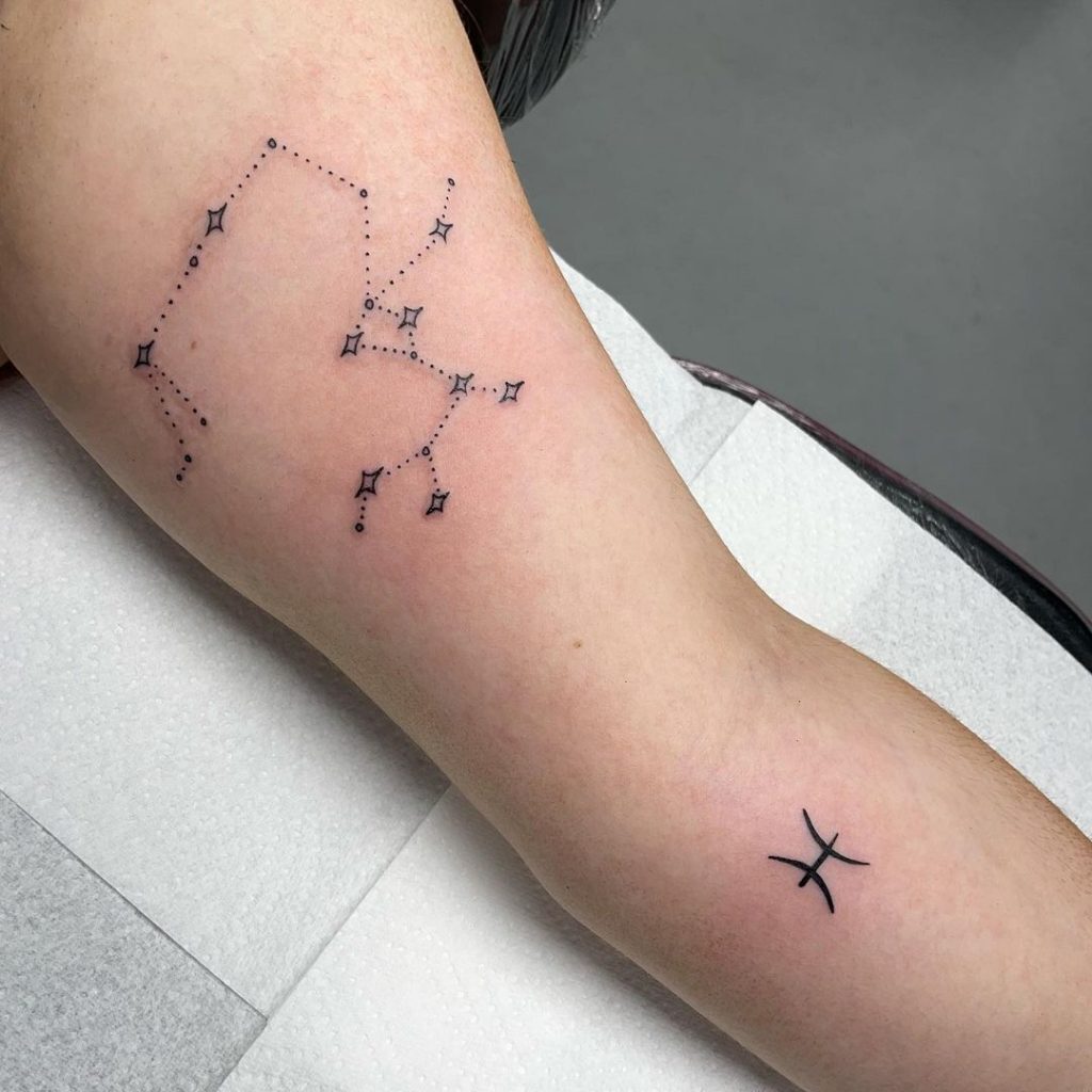 Tattoo of the zodiac sign Sagittarius on the arm