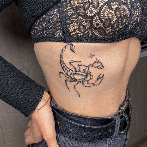 scorpion tattoo under the breast