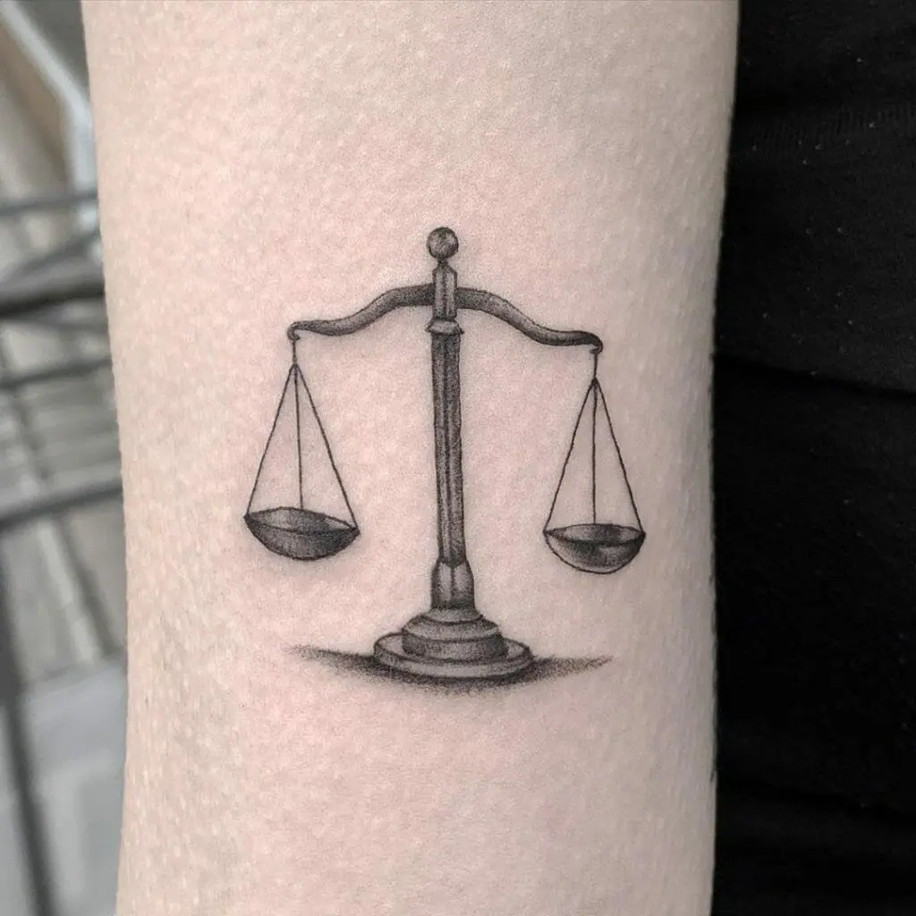 Libra zodiac sign tattoo on the arm