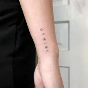 Tattoo of the zodiac sign Gemini on the wrist