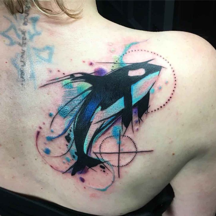 Tattoo of an orca on the scapula