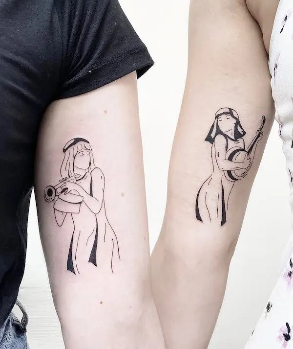 Gemini couple tattoo on forearm