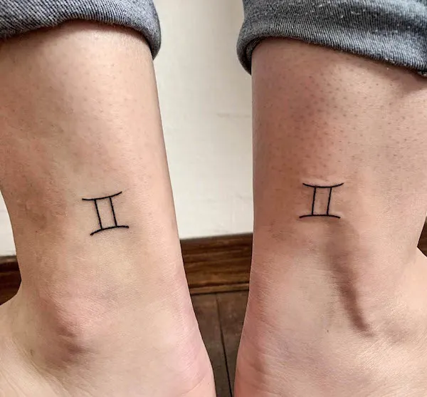 Tattoo of the symbol Gemini on his legs