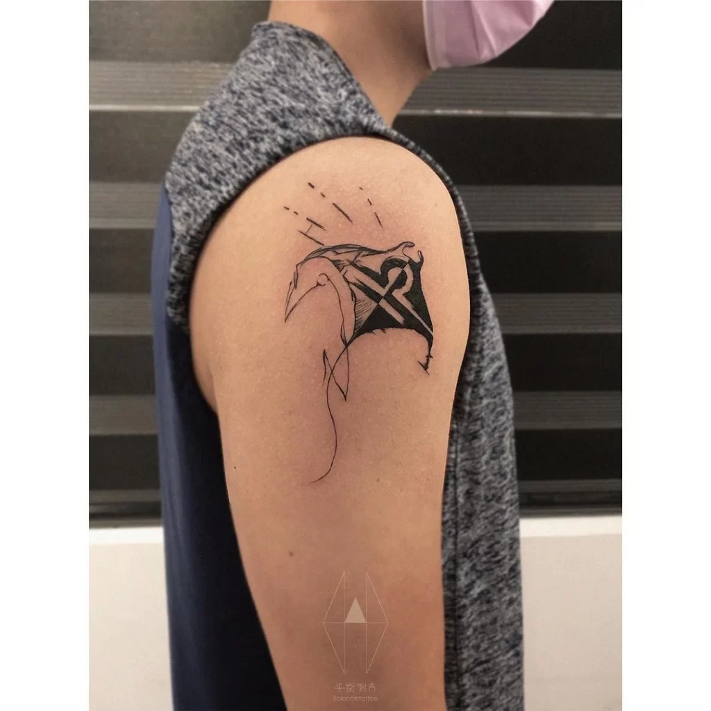 Libra symbol tattoo on the shoulder