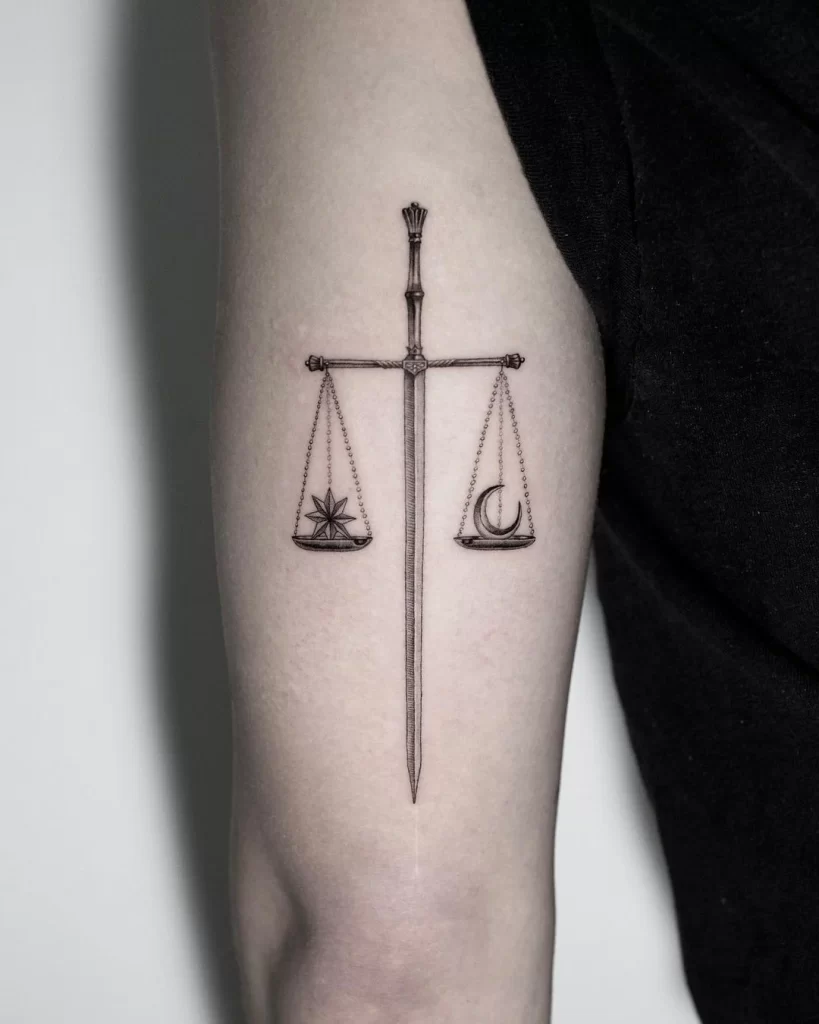 Libra zodiac sign tattoo on the arm