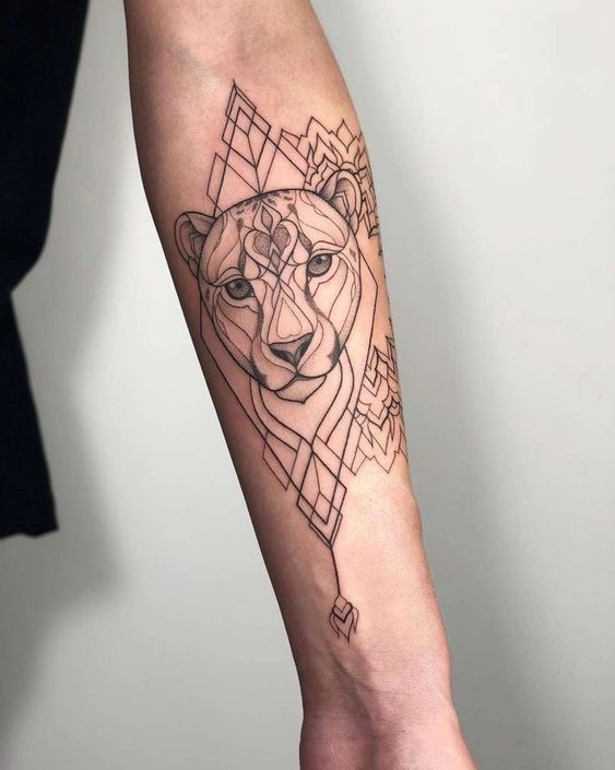 Tattoo of the zodiac sign lion on the forearm for women