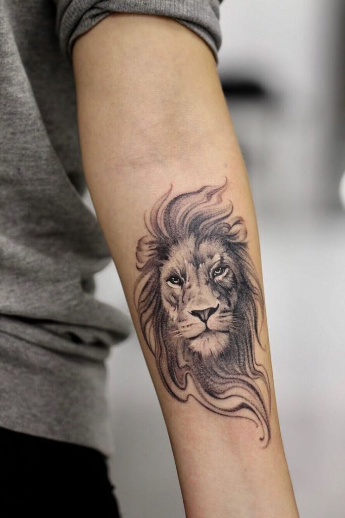 Tattoo of the zodiac sign lion on the forearm for women