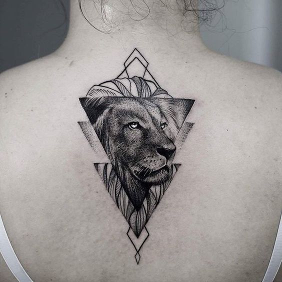 Tattoo of the zodiac sign lion on the back for women