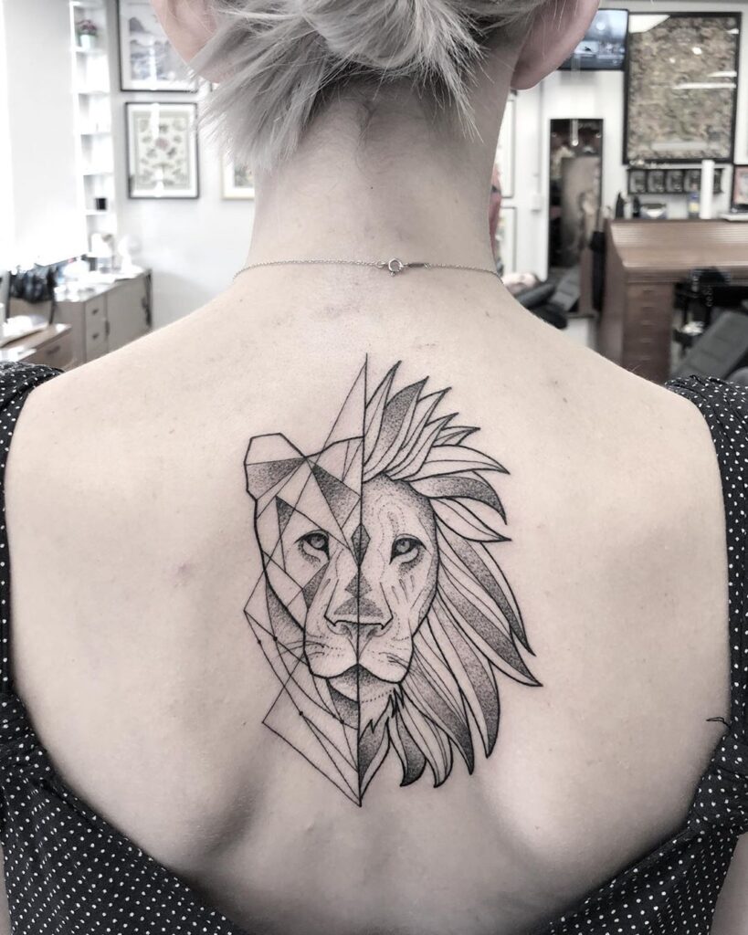 Tattoo of the zodiac sign lion on the back for women