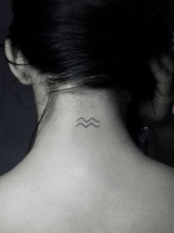 Tattoo of the zodiac sign Aquarius on the back of the head for women